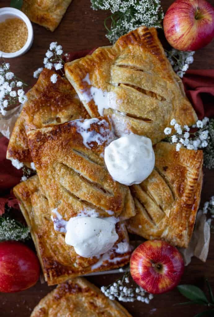 Apple hand pies topped in melty vanilla ice cream