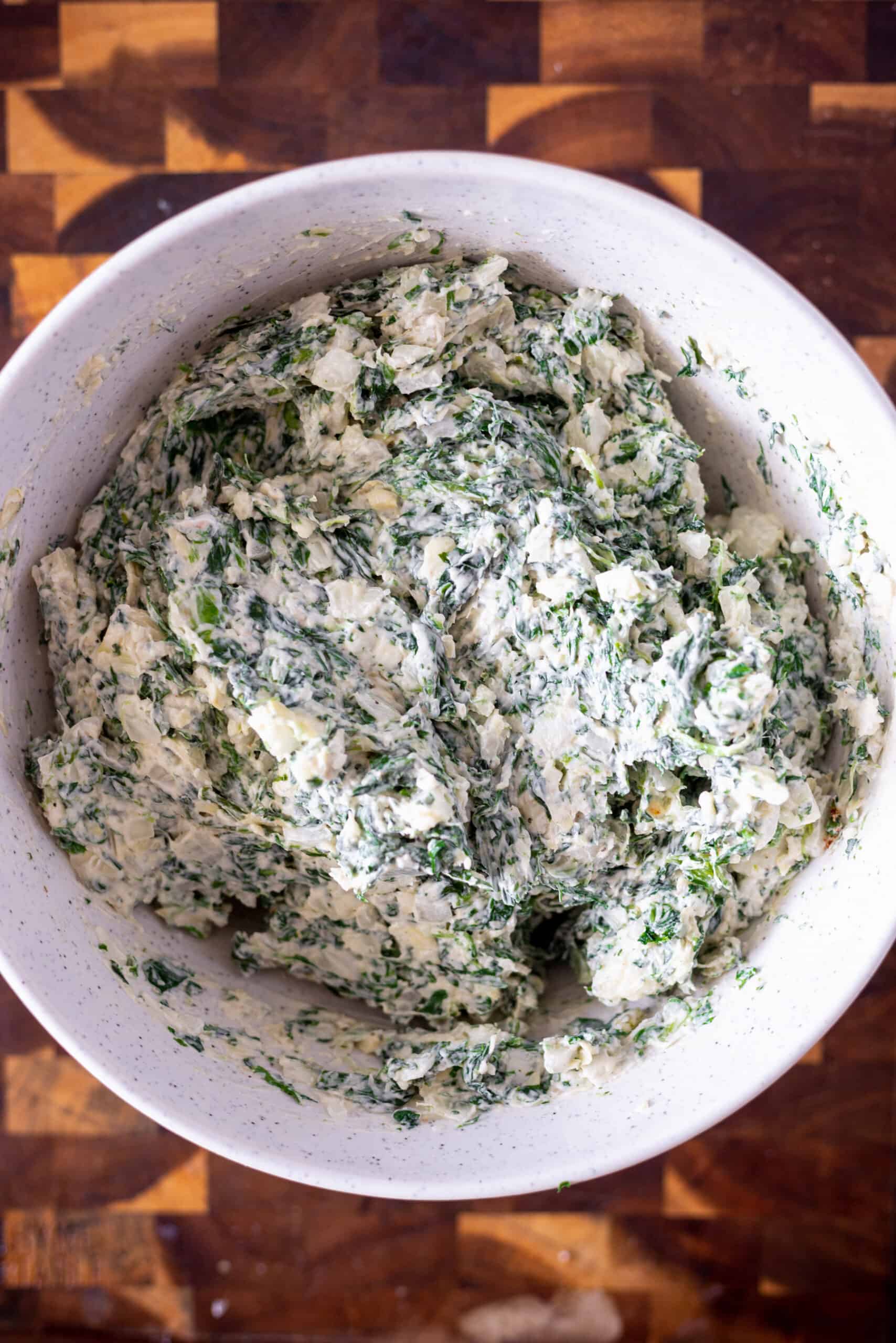 Ingredients for spinach dip mixed together