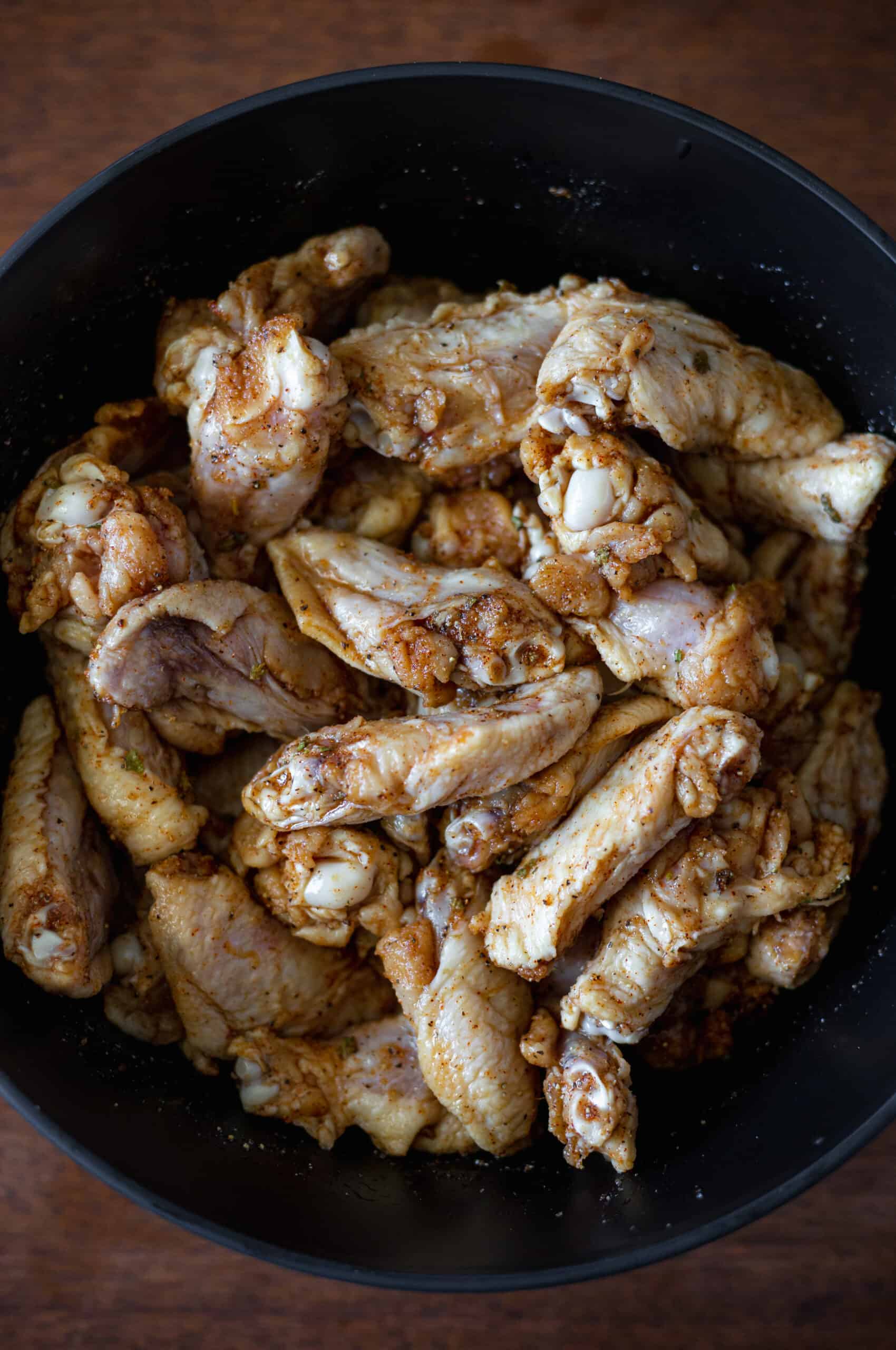 Big bowl of chicken wings tossed in dry rub 