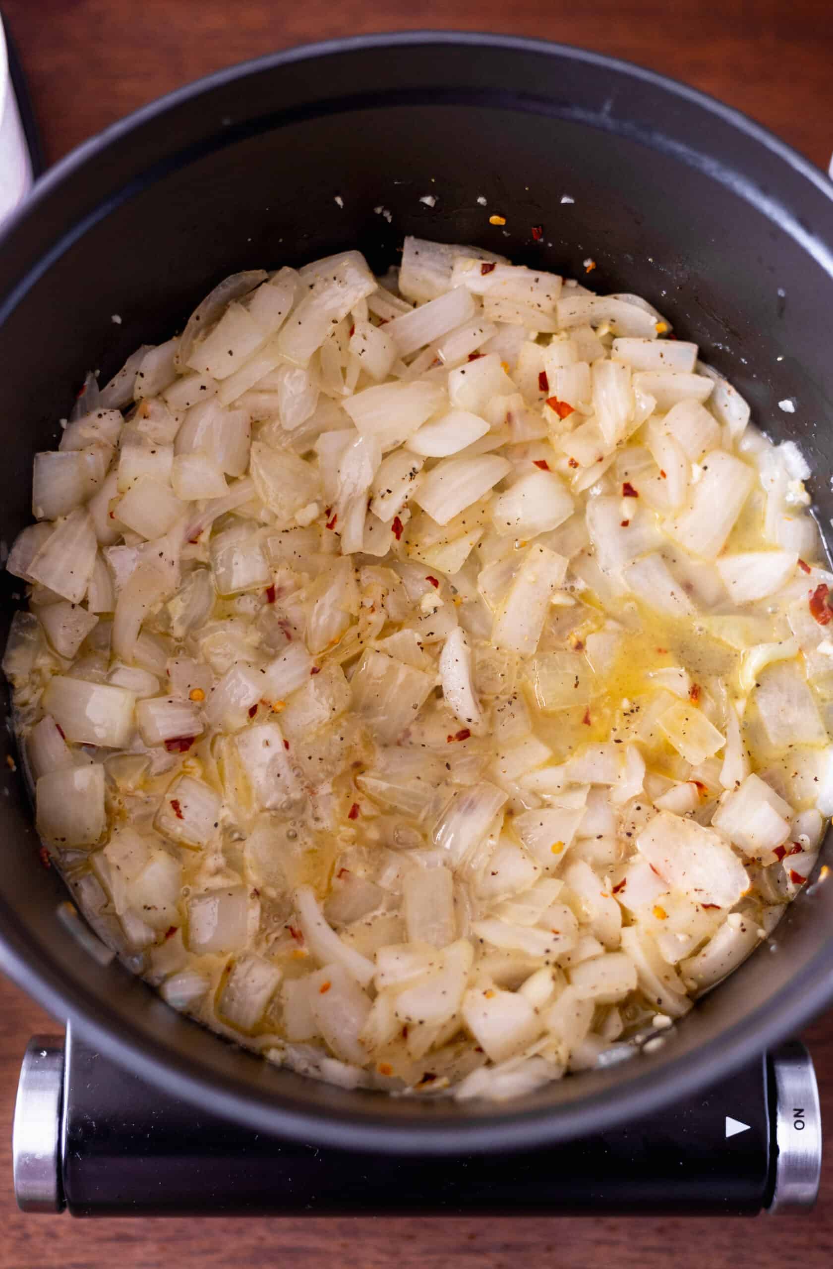 Softened onion in a large pot