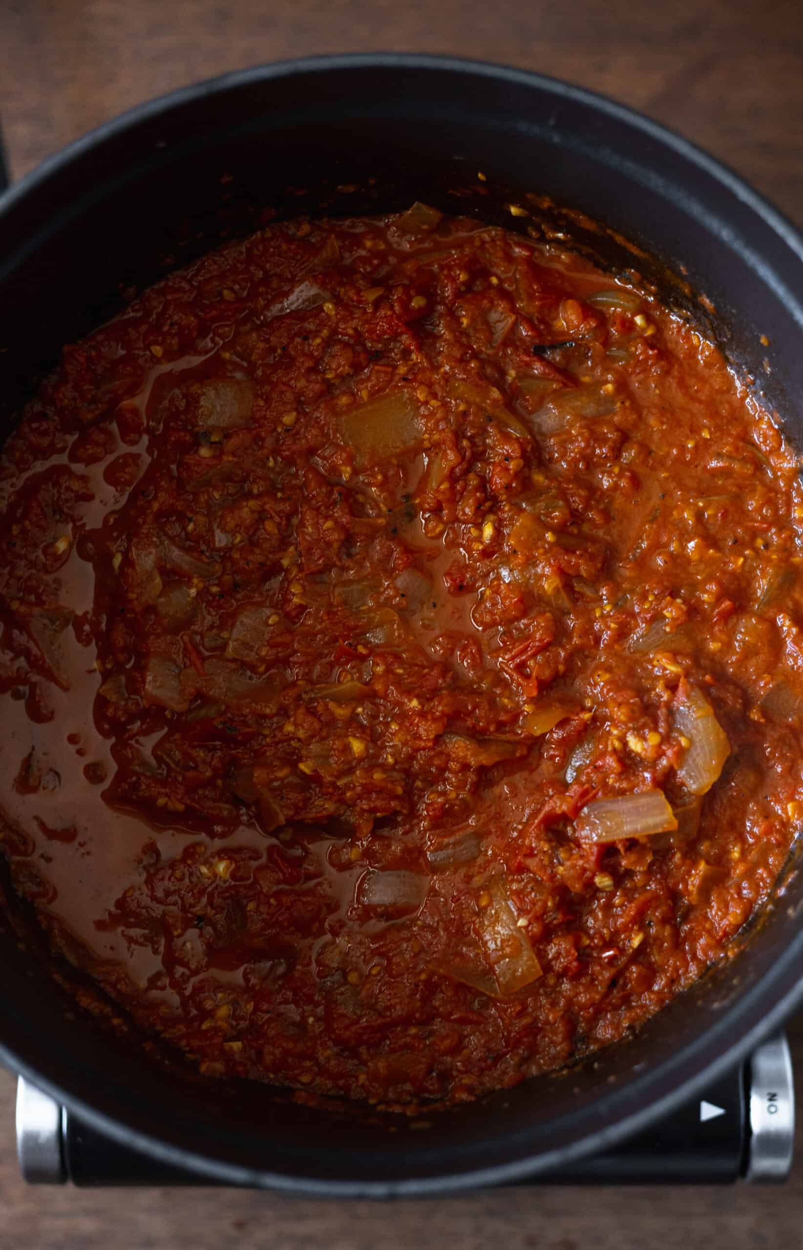 Reduced tomato puree in homemade pasta sauce