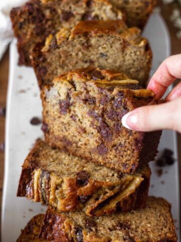 Grabbing a slice of chocolate chip banana bread
