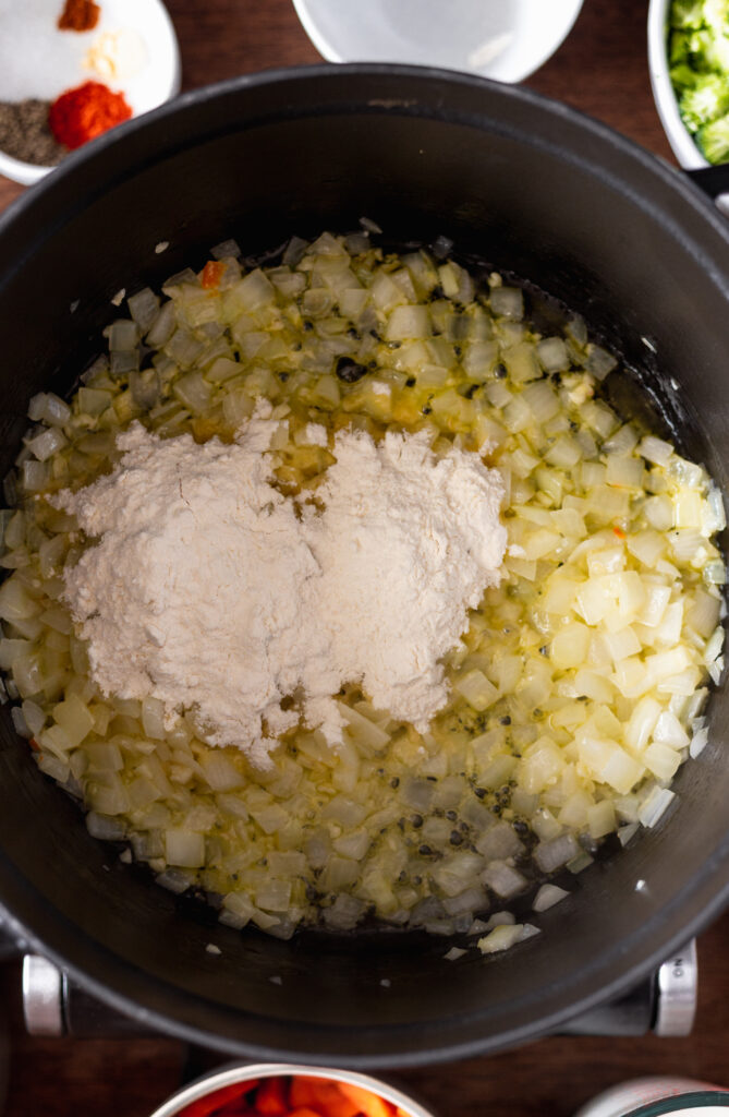 flour added to onion in a pot