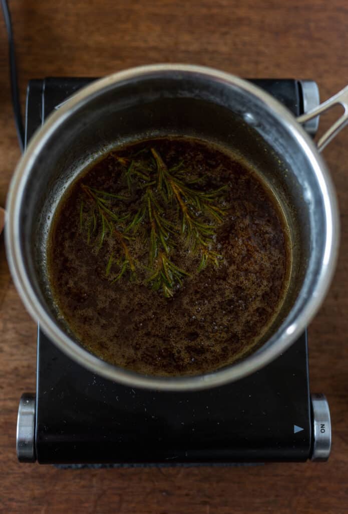 Rosemary maple sauce in a saucepan