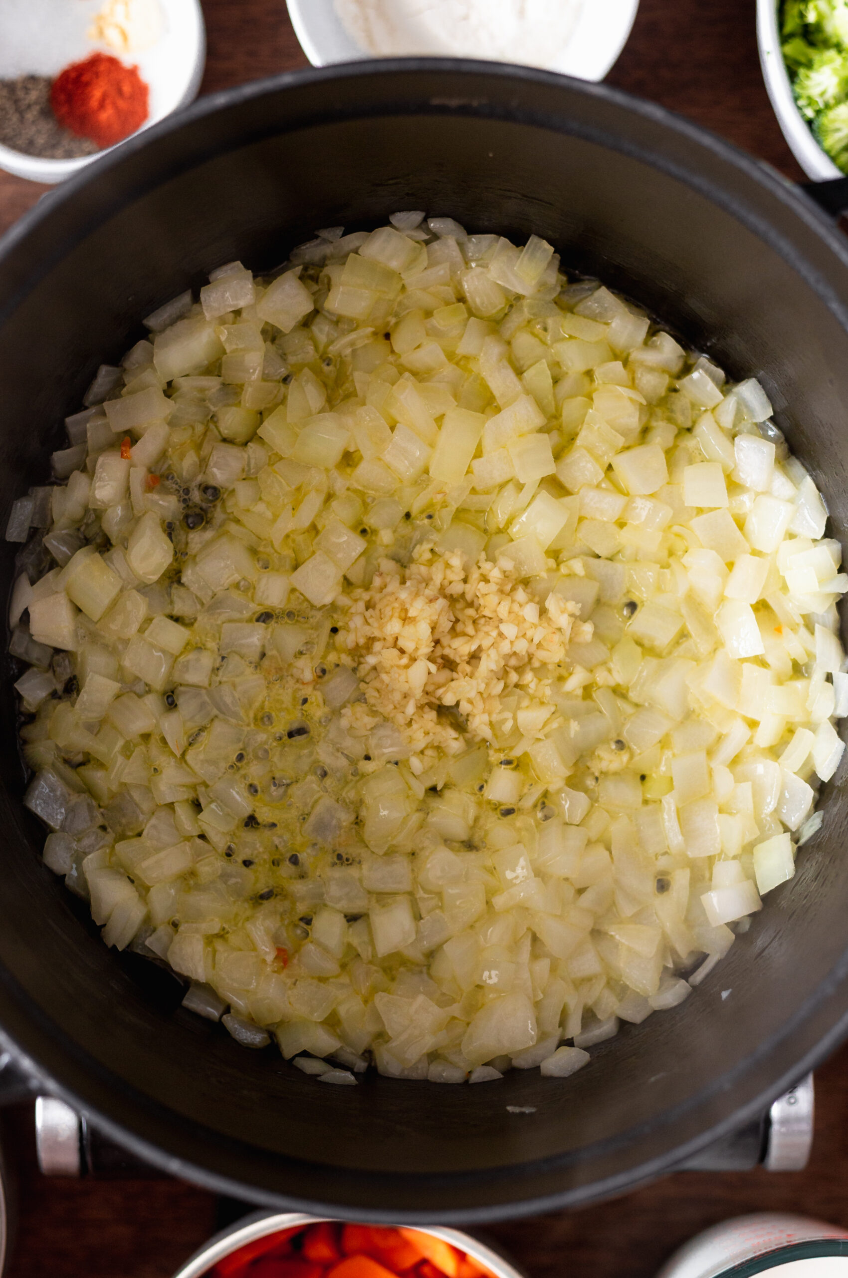 Garlic added to onion in a pot