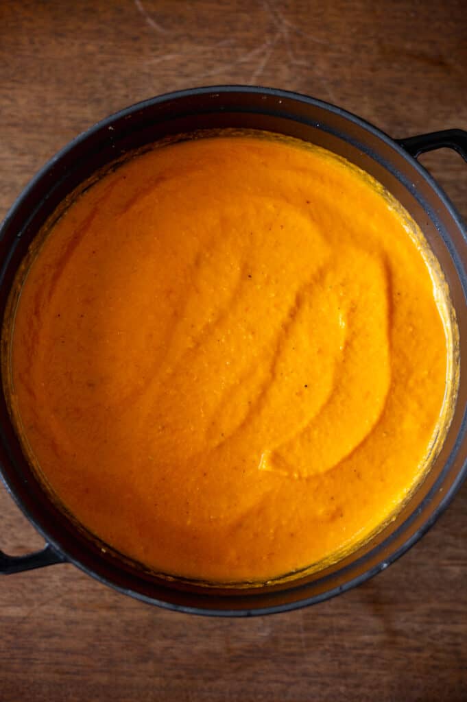 Silky smooth butternut squash soup in dutch oven
