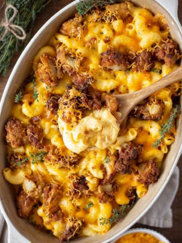 southern fried chicken in a baking dish with mac and cheese