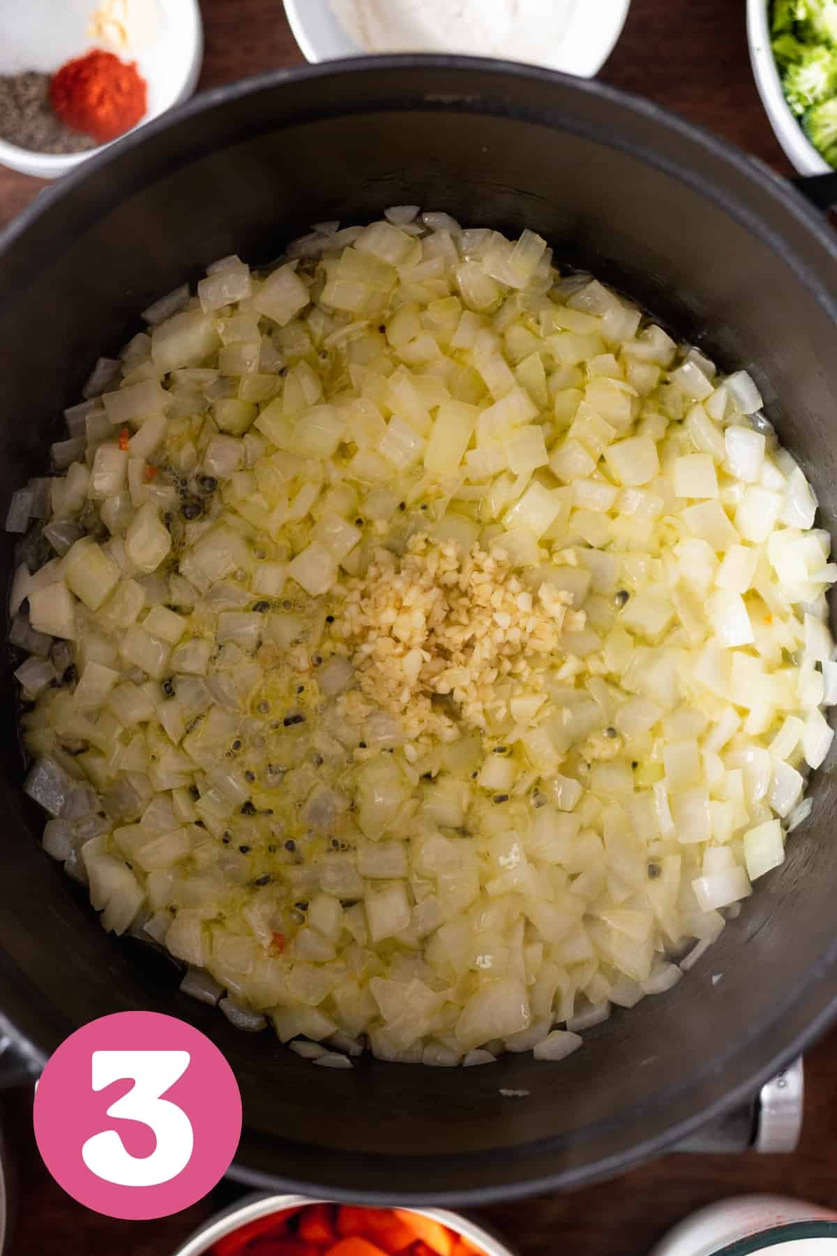 garlic added to onion in a large pot