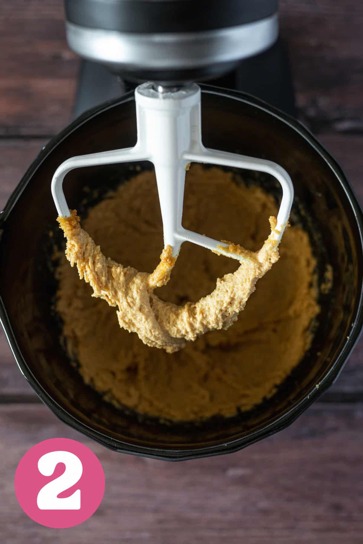 Fluffed butter and sugar in a kitchen aid bowl