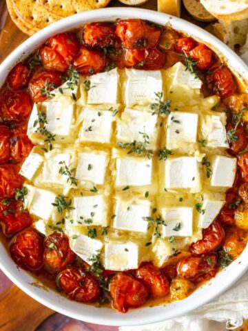 Roasted tomatoes in a brie baker with garlic baked brie