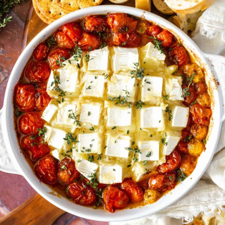 Roasted tomatoes in a brie baker with garlic baked brie