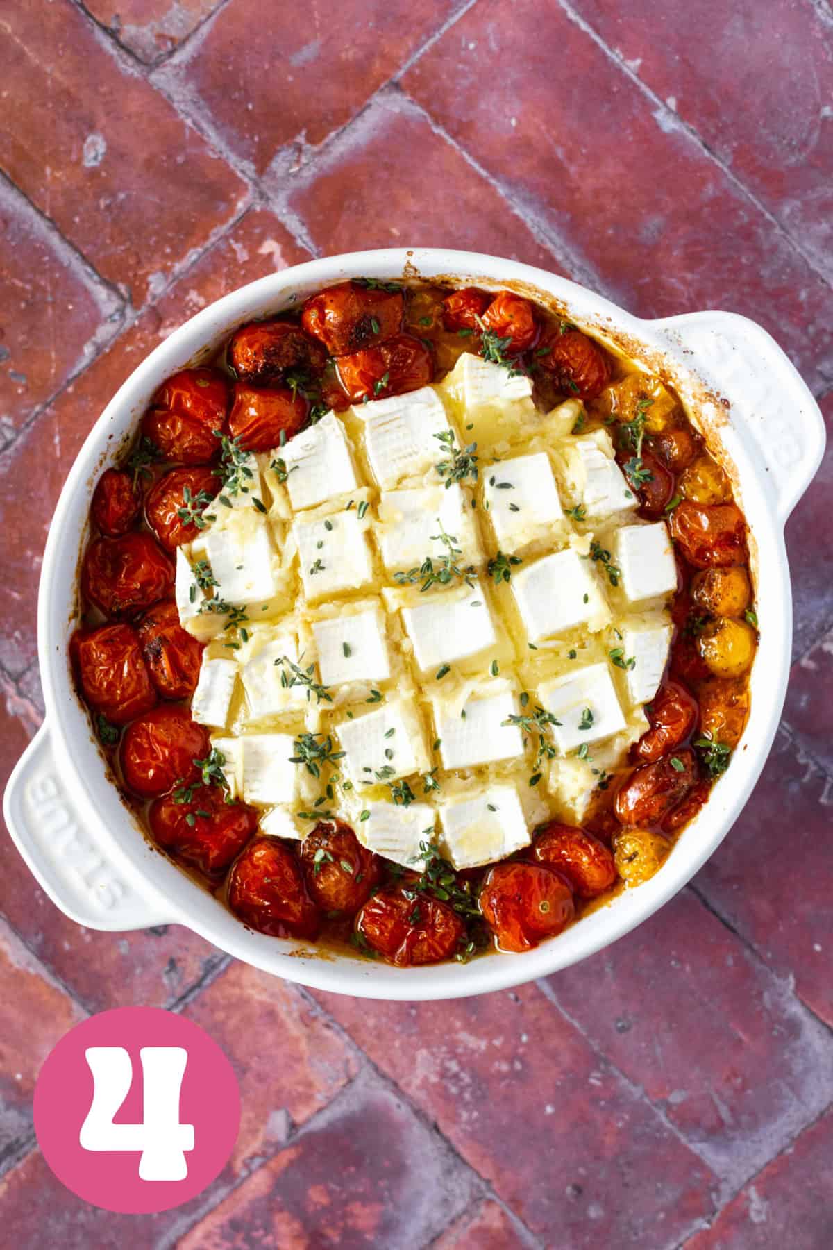 Gooey melted brie in a brie baker after being cooked