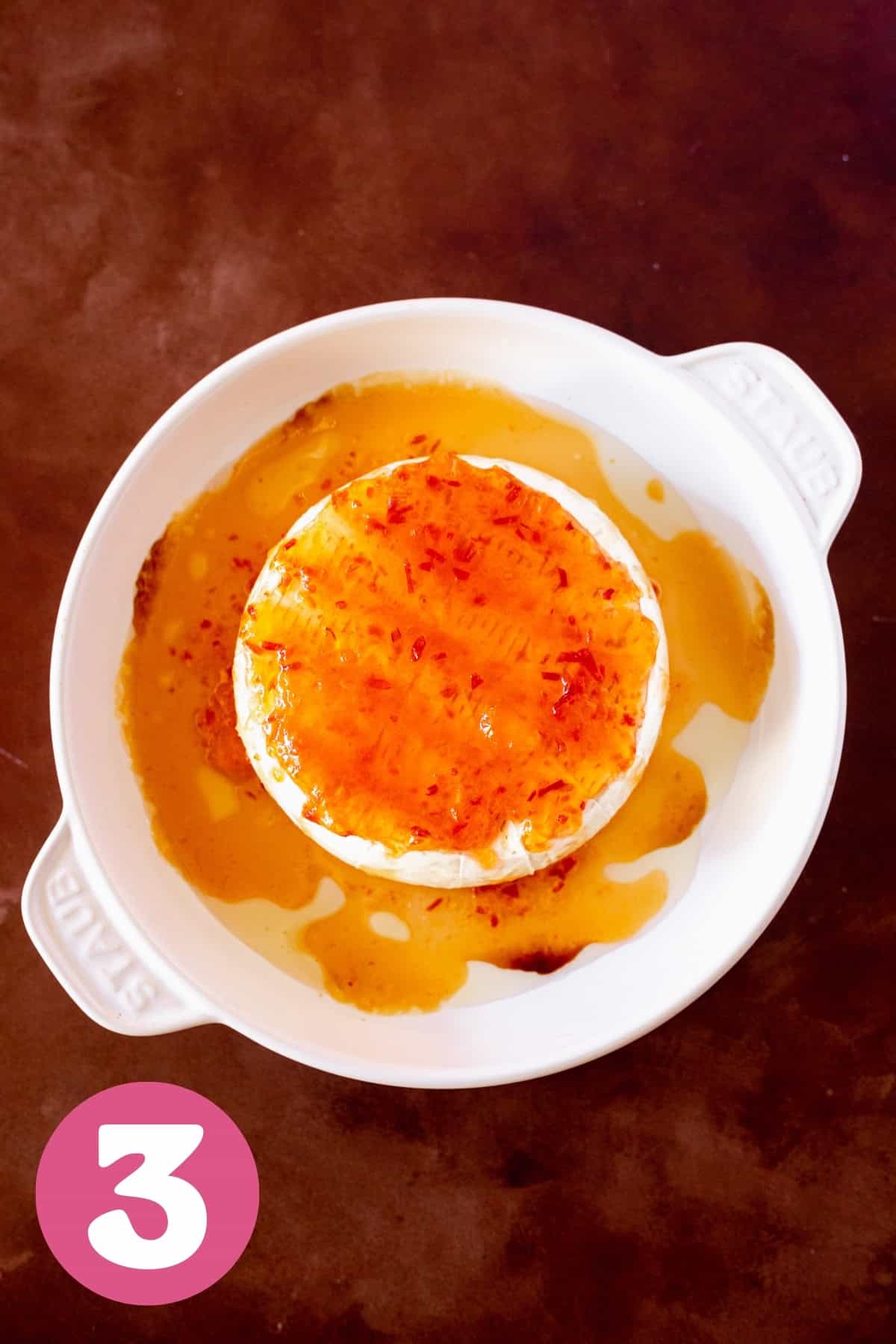 Hot pepper jelly melted on top of baked brie